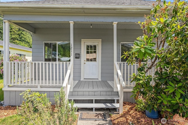 1211 Larch St, Raymond, WA 98577 - property entrance with covered porch and roof with shingles