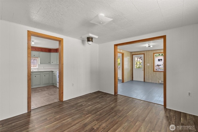 1211 Larch St, Raymond, WA 98577 - empty room featuring dark wood-style flooring