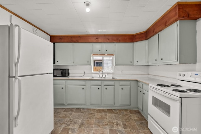 1211 Larch St, Raymond, WA 98577 - kitchen featuring white appliances, light countertops, and stone finish floors