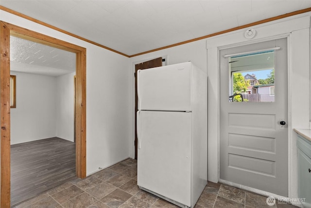 1211 Larch St, Raymond, WA 98577 - kitchen featuring freestanding refrigerator and dark stone finish floors