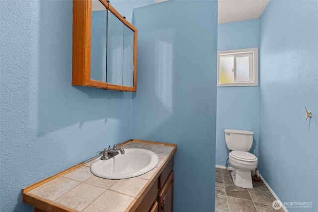 1211 Larch St, Raymond, WA 98577 - bathroom with vanity and stone finish flooring