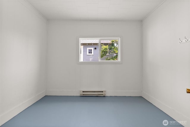 1211 Larch St, Raymond, WA 98577 - unfurnished room featuring a baseboard radiator and finished concrete flooring