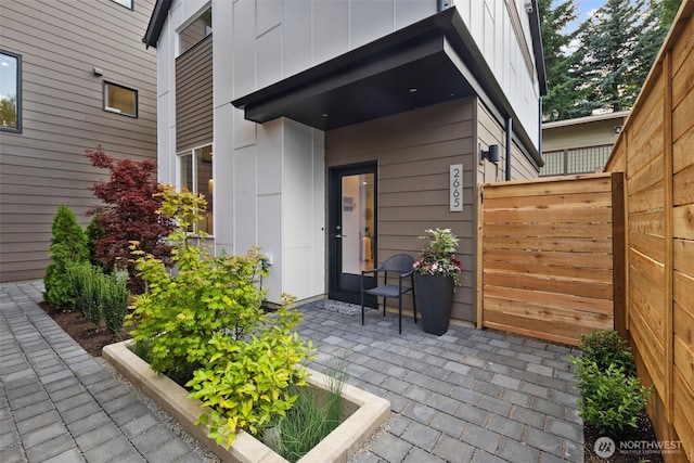 2665 51st Ave SW, Seattle, WA 98116 - doorway to property featuring board and batten siding