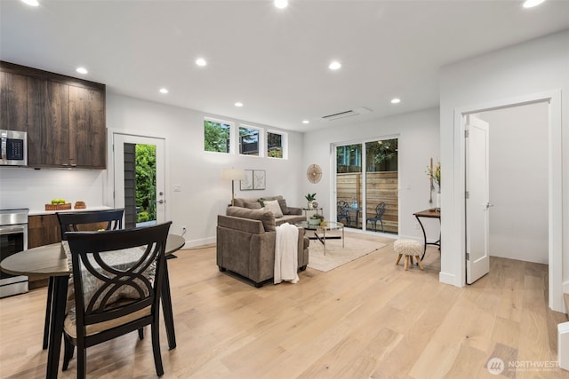 2665 51st Ave SW, Seattle, WA 98116 - living area featuring plenty of natural light, light wood-type flooring, and recessed lighting