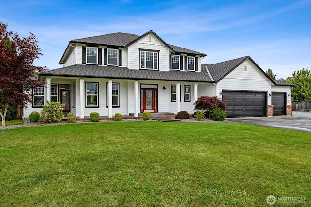 14808 172nd St E, Orting, WA 98360 - view of front of property featuring an attached garage, driveway, covered porch, a front yard, and roof with shingles