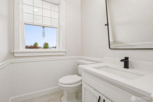 14808 172nd St E, Orting, WA 98360 - half bathroom featuring vanity and a wainscoted wall