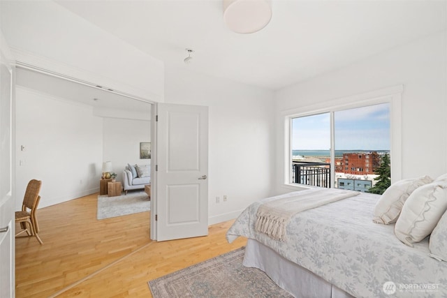 1015 Railroad Ave Unit 518, Bellingham, WA 98225 - bedroom featuring light wood-type flooring and access to exterior