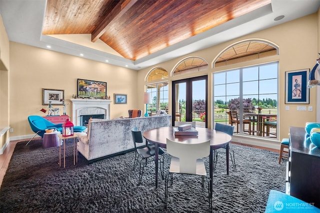 19609 NE 35th Ct, Ridgefield, WA 98642 - dining space featuring a wood ceiling with exposed beams, wood finished floors, a fireplace, high vaulted ceiling, and recessed lighting