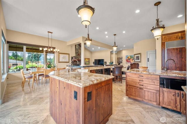 19609 NE 35th Ct, Ridgefield, WA 98642 - kitchen with light marble finish flooring, ornate columns, a large island, paneled built in refrigerator, and light stone countertops