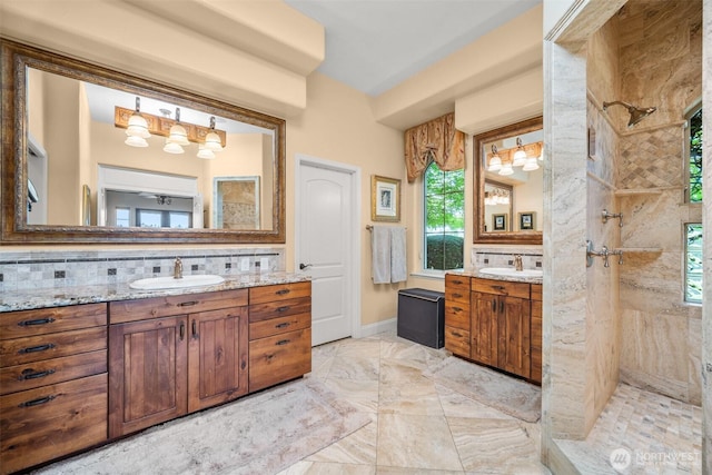 19609 NE 35th Ct, Ridgefield, WA 98642 - bathroom with backsplash, tiled shower, two vanities, and marble finish flooring