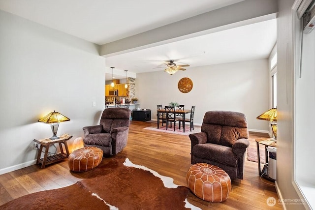 418 17th St SE Unit 9D, Auburn, WA 98002 - living room with wood finished floors and ceiling fan