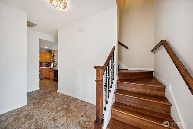 418 17th St SE Unit 9D, Auburn, WA 98002 - stairs featuring stone finish floors and baseboards