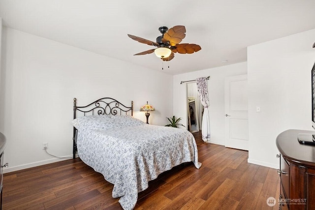 418 17th St SE Unit 9D, Auburn, WA 98002 - bedroom featuring dark wood-style floors, ceiling fan, a walk in closet, and a closet