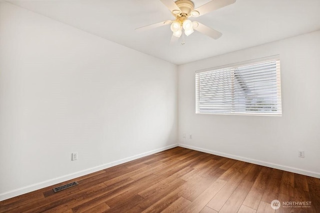 418 17th St SE Unit 9D, Auburn, WA 98002 - empty room with wood finished floors and ceiling fan