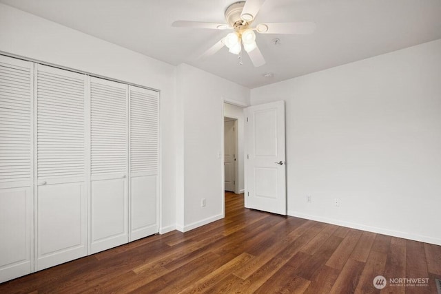 418 17th St SE Unit 9D, Auburn, WA 98002 - unfurnished bedroom featuring wood finished floors, a closet, and ceiling fan