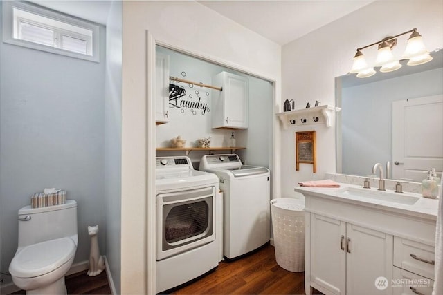 418 17th St SE Unit 9D, Auburn, WA 98002 - bathroom featuring independent washer and dryer, wood finished floors, and vanity