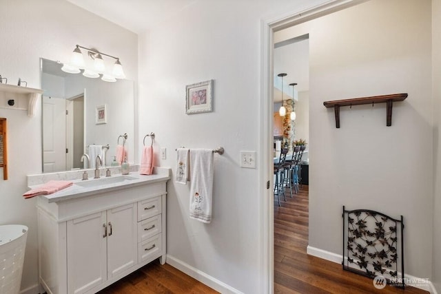 418 17th St SE Unit 9D, Auburn, WA 98002 - half bathroom featuring wood finished floors and vanity