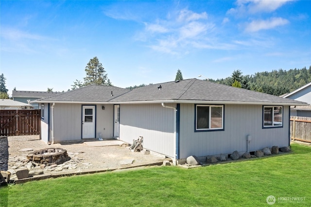 307 Brown St SE, Orting, WA 98360 - back of property featuring a fire pit and a patio area