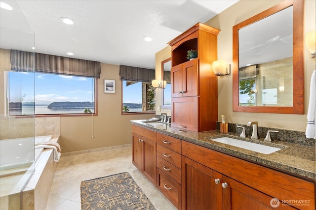 10300 64th Pl W, Mukilteo, WA 98275 - full bathroom featuring double vanity, a bath, recessed lighting, and tile patterned floors