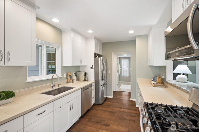 3089 W Lake Sammamish Pkwy NE, Redmond, WA 98052 - kitchen featuring appliances with stainless steel finishes, white cabinetry, dark wood-style flooring, and recessed lighting