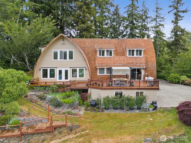 1508 Bloomhardt Rd, Raymond, WA 98577 - back of house with a wooden deck and a gambrel roof