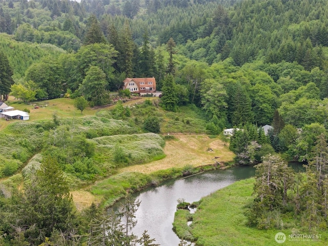1508 Bloomhardt Rd, Raymond, WA 98577 - aerial view of property and surrounding area featuring a forest and a nearby body of water