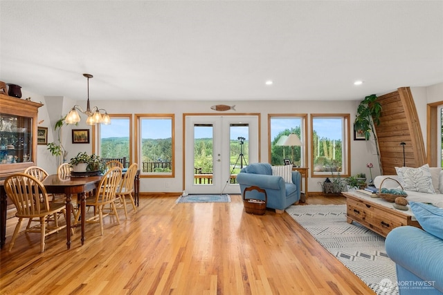 1508 Bloomhardt Rd, Raymond, WA 98577 - living room featuring light wood-style floors, plenty of natural light, a chandelier, and recessed lighting
