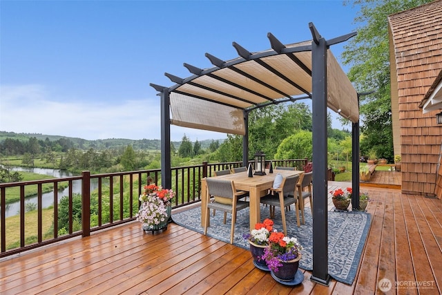 1508 Bloomhardt Rd, Raymond, WA 98577 - deck with a pergola, outdoor dining space, and a water view