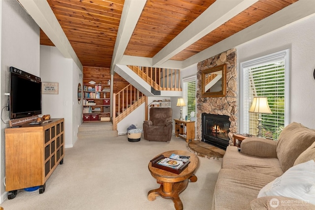 1508 Bloomhardt Rd, Raymond, WA 98577 - carpeted living area with a wood ceiling with exposed beams, a fireplace, and stairs