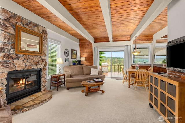 1508 Bloomhardt Rd, Raymond, WA 98577 - carpeted living area with a wood ceiling with exposed beams and a fireplace