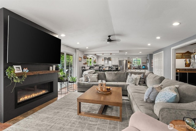 755 Elm St, Raymond, WA 98577 - living room featuring ceiling fan, recessed lighting, a fireplace, and vaulted ceiling