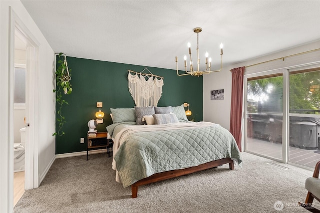 755 Elm St, Raymond, WA 98577 - bedroom featuring access to exterior, a chandelier, and carpet flooring