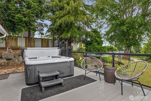 755 Elm St, Raymond, WA 98577 - wooden deck with a hot tub