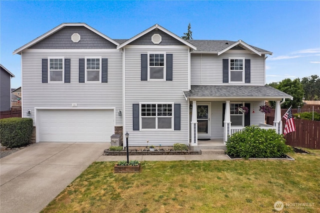 516 Emerald Ct SE, Rainier, WA 98576 - traditional-style home with covered porch, an attached garage, driveway, and a shingled roof