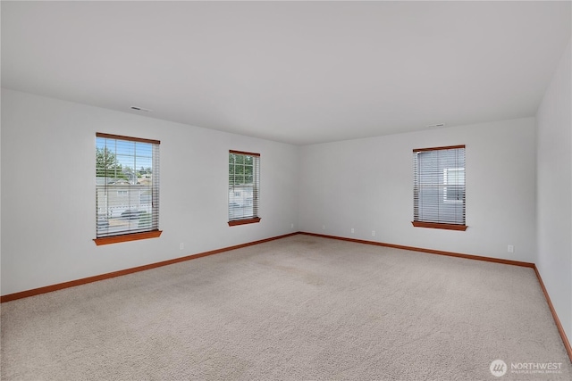 516 Emerald Ct SE, Rainier, WA 98576 - carpeted empty room featuring baseboards