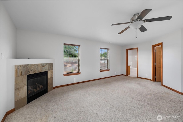 516 Emerald Ct SE, Rainier, WA 98576 - unfurnished living room with a fireplace, carpet, and ceiling fan