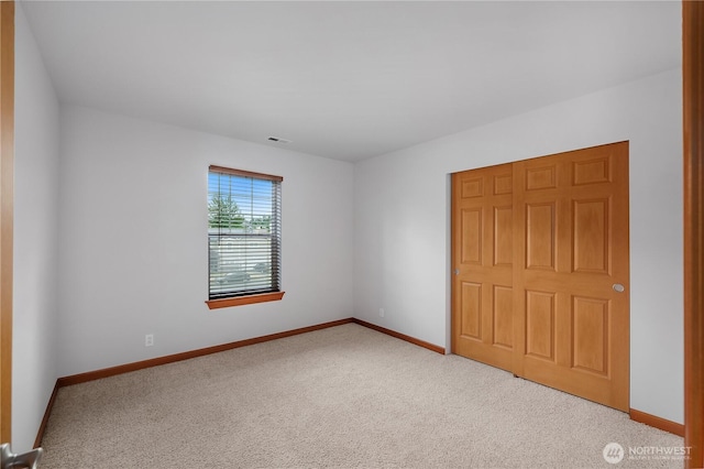 516 Emerald Ct SE, Rainier, WA 98576 - unfurnished bedroom with carpet flooring and baseboards