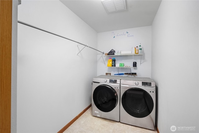 516 Emerald Ct SE, Rainier, WA 98576 - laundry area with washer and clothes dryer and baseboards