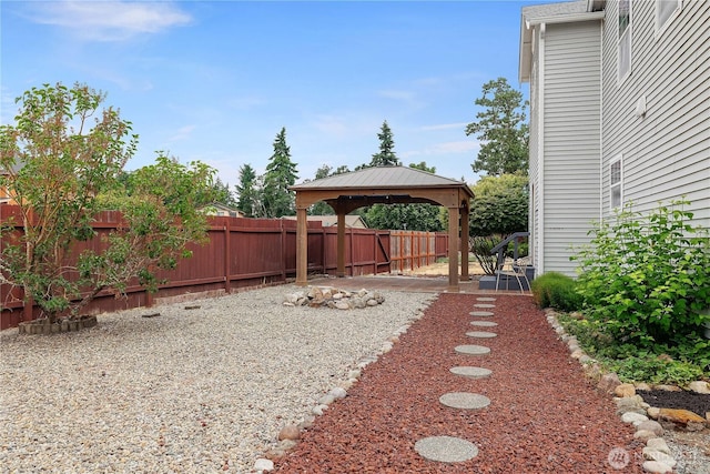 516 Emerald Ct SE, Rainier, WA 98576 - fenced backyard with a gazebo and a patio area
