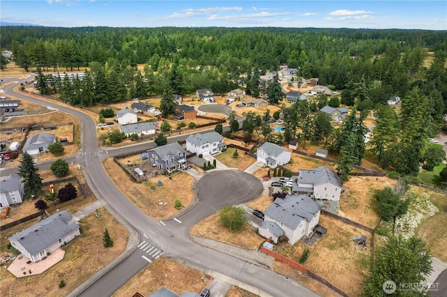 516 Emerald Ct SE, Rainier, WA 98576 - aerial view of property and surrounding area with nearby suburban area