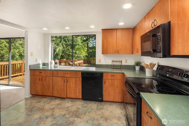 13919 SE 3rd Pl, Bellevue, WA 98005 - kitchen featuring black appliances, healthy amount of natural light, recessed lighting, and brown cabinetry