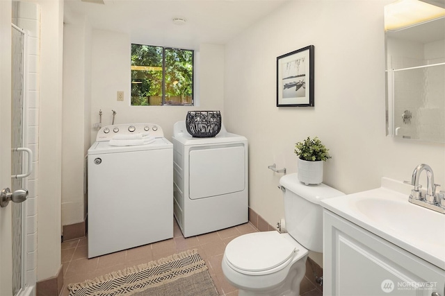 13919 SE 3rd Pl, Bellevue, WA 98005 - bathroom featuring washer and dryer, vanity, an enclosed shower, and tile patterned floors