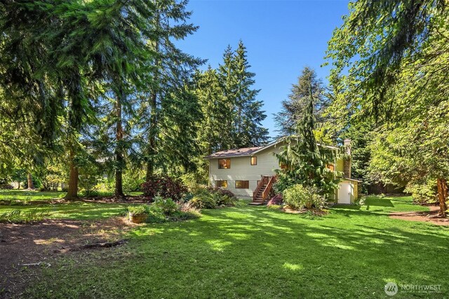 13919 SE 3rd Pl, Bellevue, WA 98005 - view of grassy yard featuring stairs and a deck