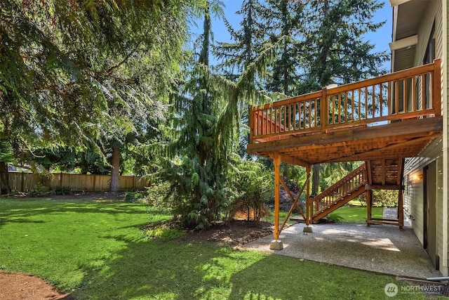 13919 SE 3rd Pl, Bellevue, WA 98005 - view of yard featuring a wooden deck, stairway, and a patio area