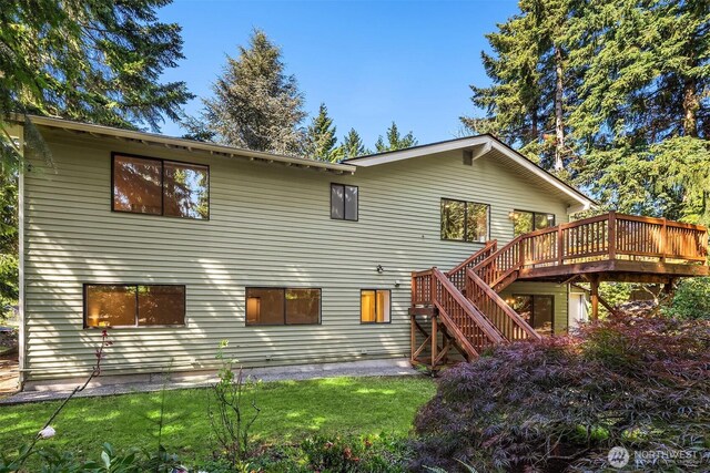 13919 SE 3rd Pl, Bellevue, WA 98005 - back of property with stairs, a deck, and a lawn