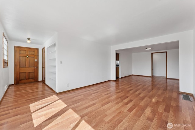 2117 S Ash St, Tacoma, WA 98405 - foyer entrance with light wood-type flooring and baseboards