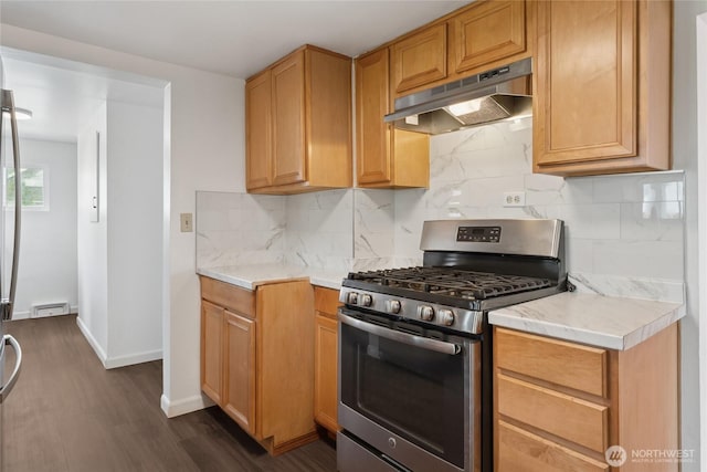 2117 S Ash St, Tacoma, WA 98405 - kitchen with stainless steel range with gas stovetop, under cabinet range hood, light countertops, and dark wood-style flooring