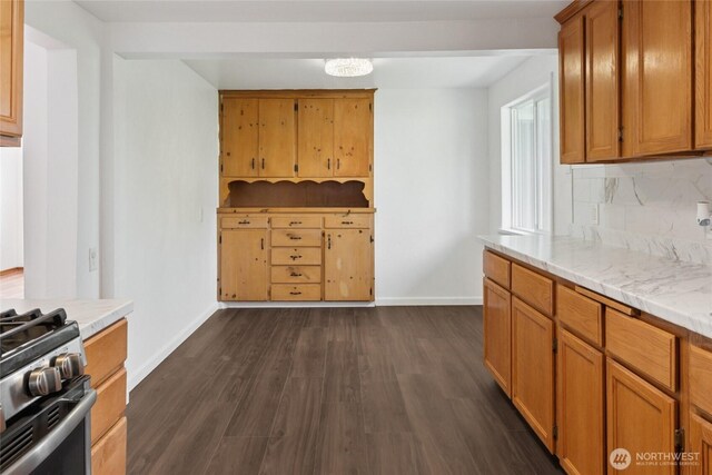 2117 S Ash St, Tacoma, WA 98405 - kitchen featuring decorative backsplash, dark wood-style flooring, light countertops, brown cabinets, and stainless steel gas stove