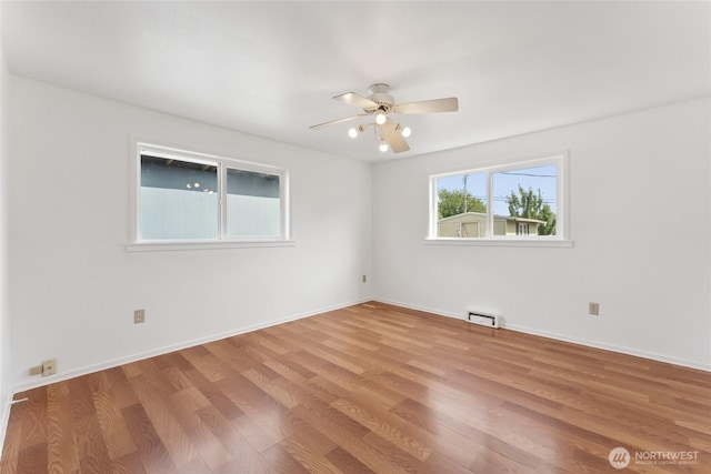 2117 S Ash St, Tacoma, WA 98405 - unfurnished room featuring ceiling fan and wood finished floors