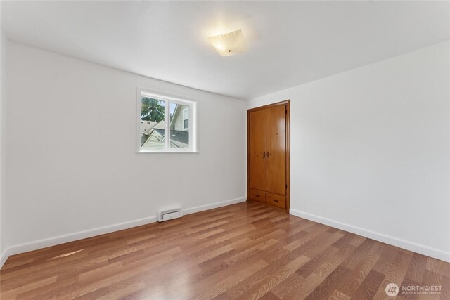 2117 S Ash St, Tacoma, WA 98405 - spare room with light wood-type flooring and baseboards